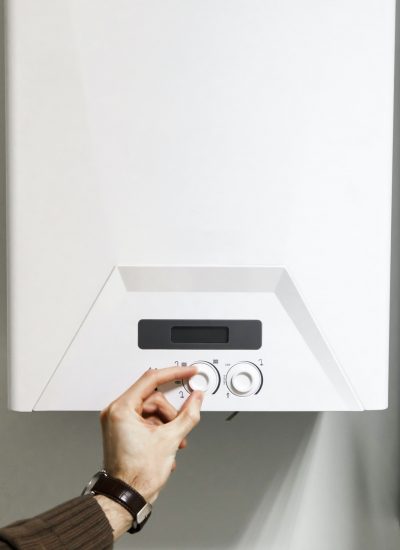 man regulate heating boiler control panel